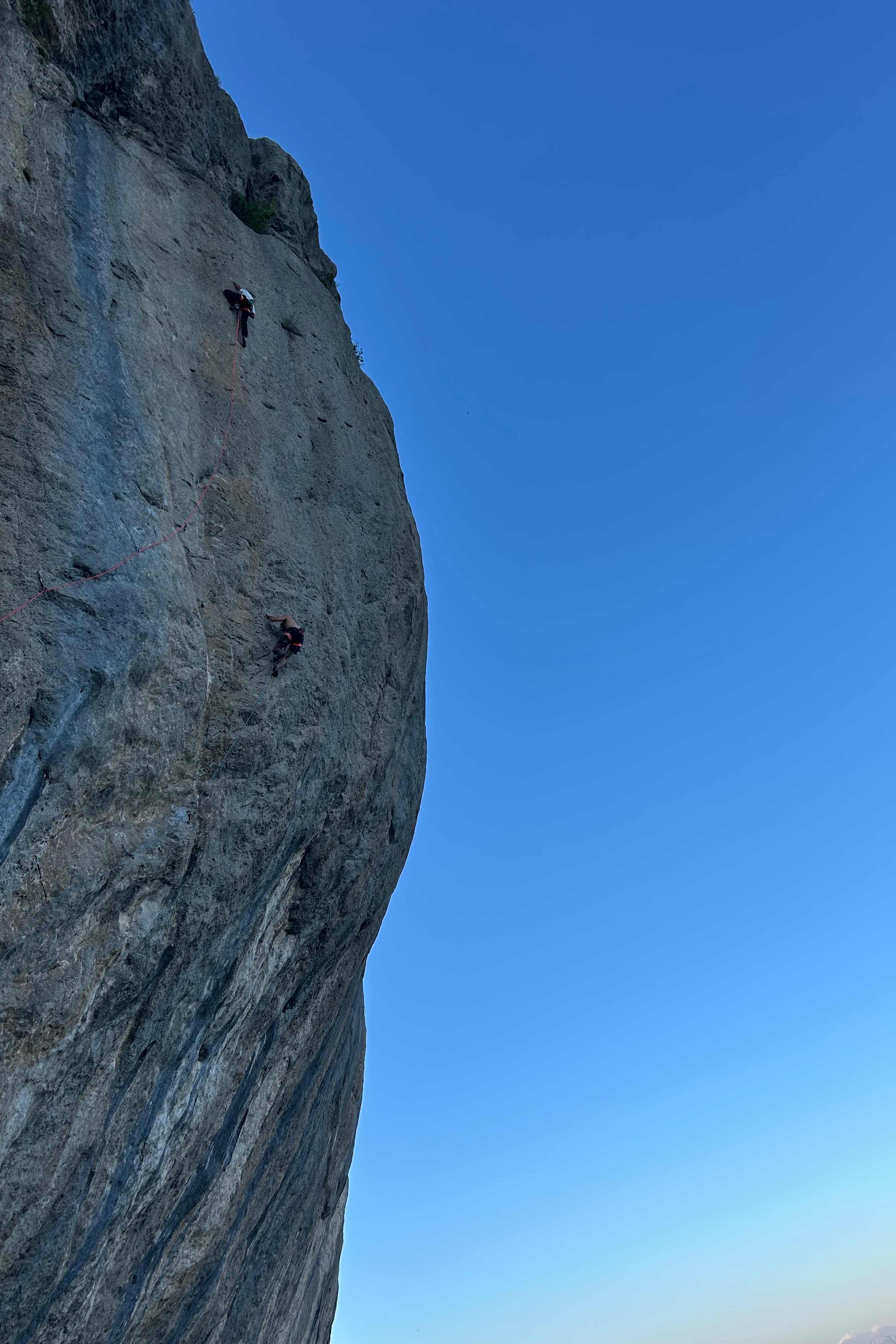 Rock climbing on a tall cliff face